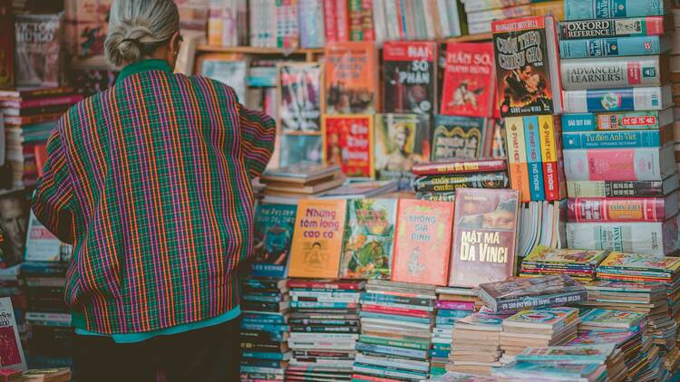 A man perusing books at a bookshop.