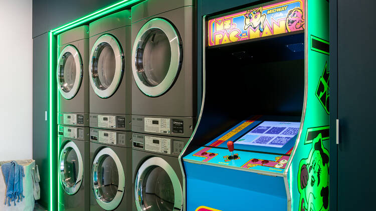 A laundromat with an arcade game inside.