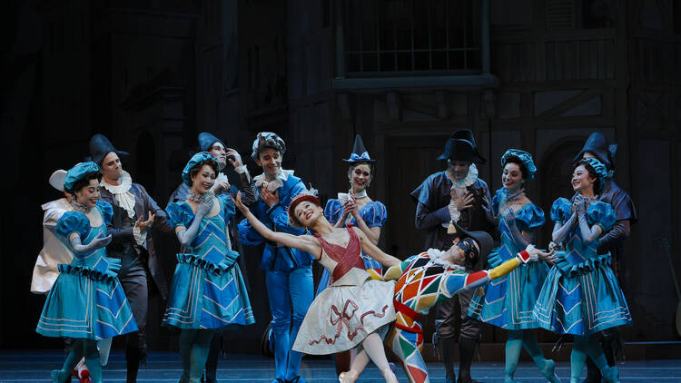 Ballet dancers in colourful costumes on stage for Harlequinade