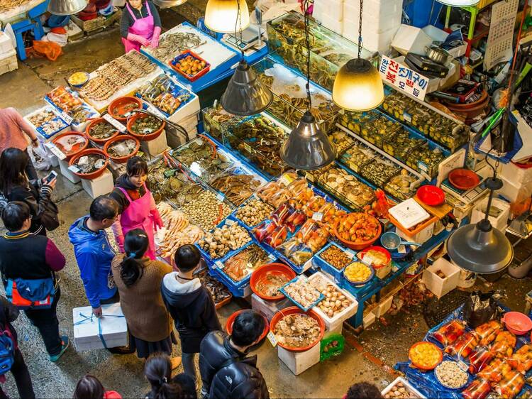 Try fresh sashimi and live octopus at Noryangjin Fish Market