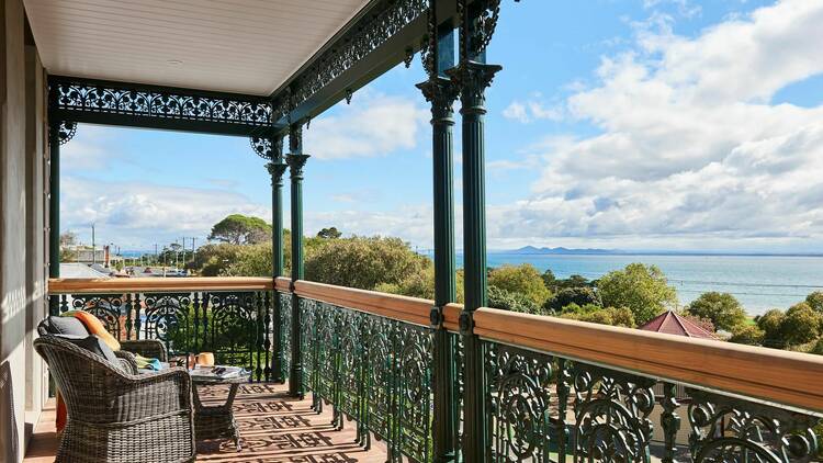 A balcony with outdoor furniture at the portarlington grand hotel.
