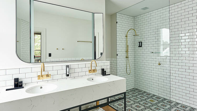 A large white bathroom in the portarlington grand hotel.