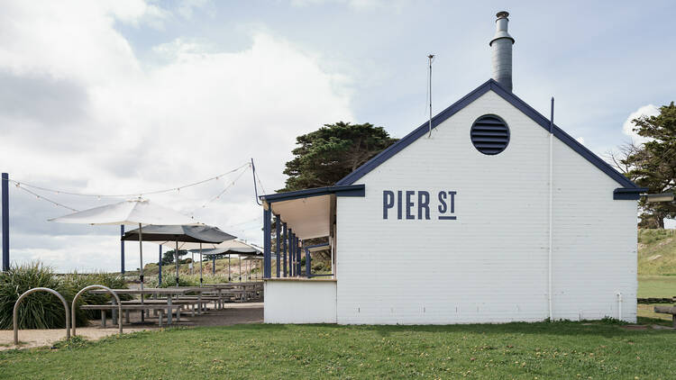 A white and blue cafe by the Portarlington Pier.