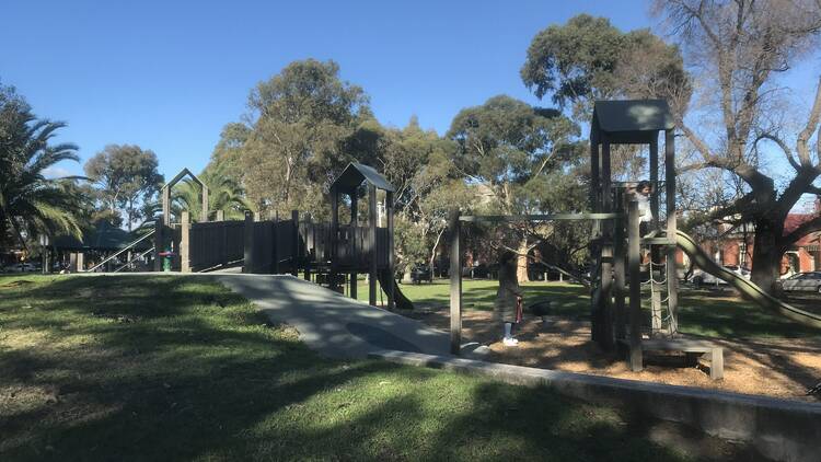 A faraway shot of a wooden playground