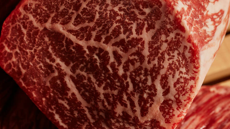 A close up of the marbled steak raw