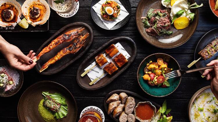 A table filled with platters of food at Longsong.