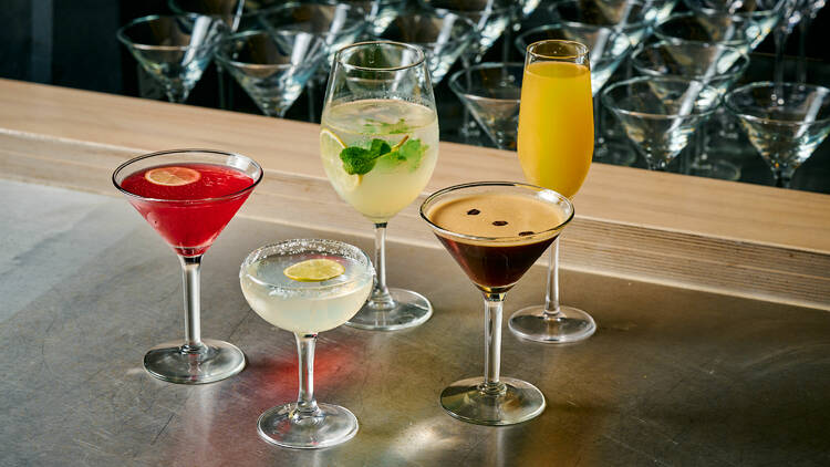 A line-up of five cocktails.