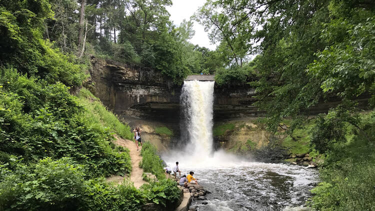 Minnehaha Falls in Minneapolis Minnesota on a bright green summer morning