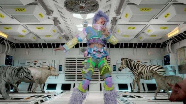 A person in a futuristic purple costume dances in a white space ship looking room surrounded by stuffed animals