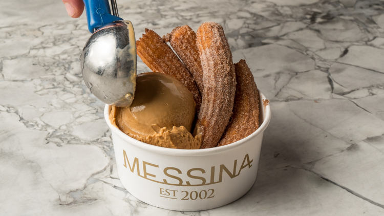 Churros in a cup with caramel icecream