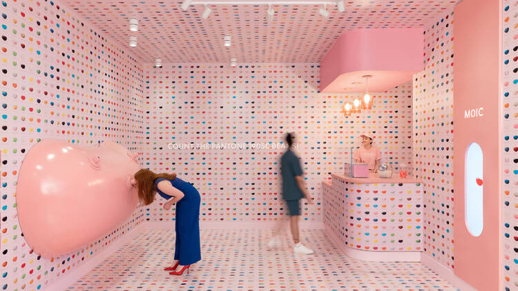 People explore a jelly bean-themed room at the Museum of Ice Cream Chicago