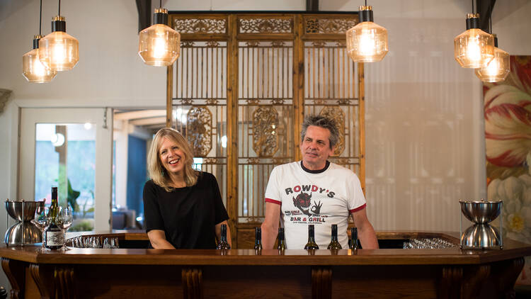 Rasa Fabian and Richard Woods, owners of Shut the Gate winery, stand behind the bar