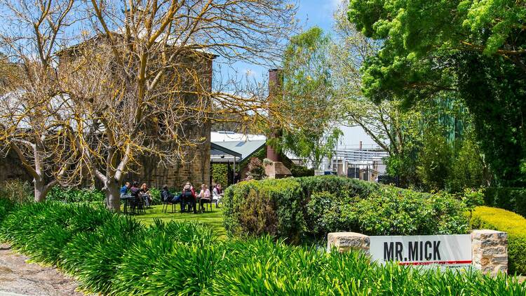 Diners sit on the lawn at the Mr Mick restaurant