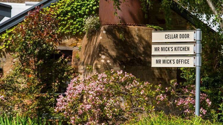 The Mr Mick signpost leads the way to the kitchen and cellar door