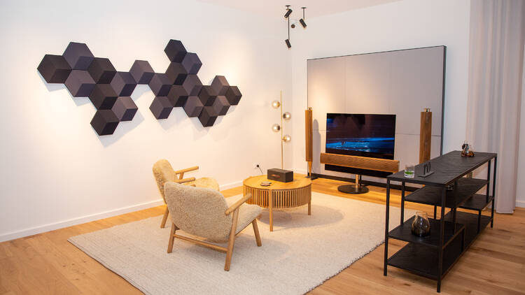 A room with luxury audio systems and a seating area.