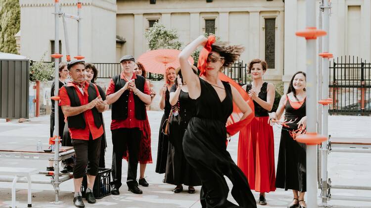 dancers wearing black and red at Italian Day 