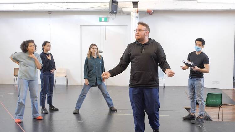 Five actors rehearsing