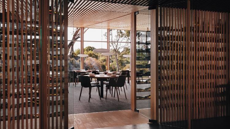 A wooden entryway to Wickens restaurant at the Royal Mail Hotel.