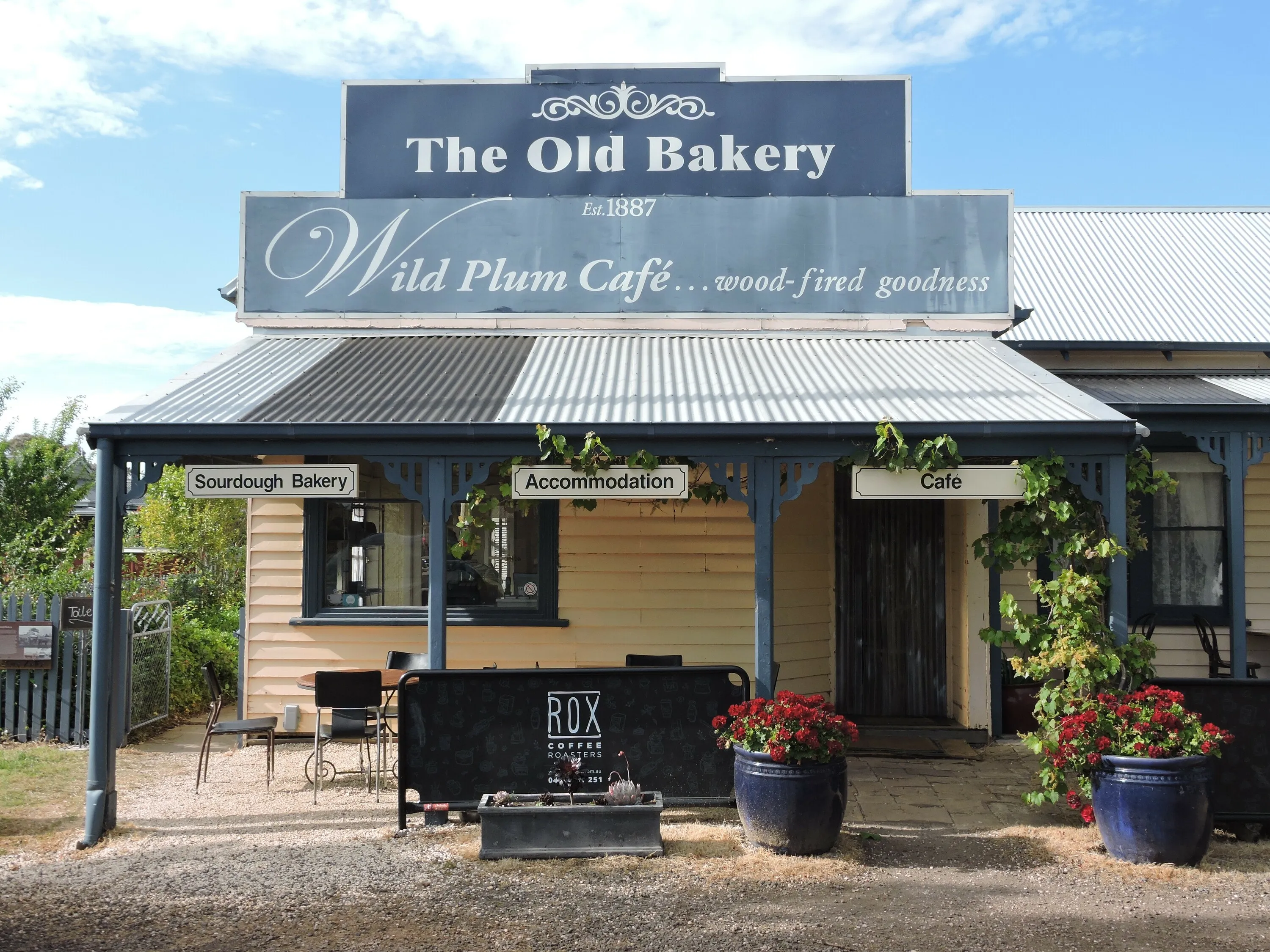 The blue and yellow exterior of Dunkeld Old Bakery.