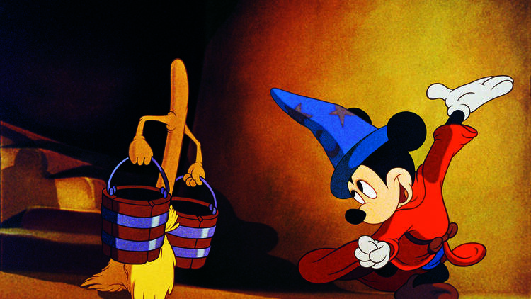 A still image from the movie Fantasia showing Mickey Mouse and a broom carrying two pails of water.