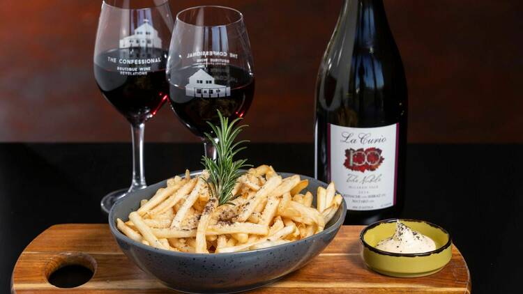 The Confessional wine and fries