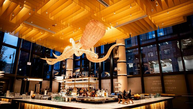 An octopus sculpture hanging over the bar of Bar Mar.