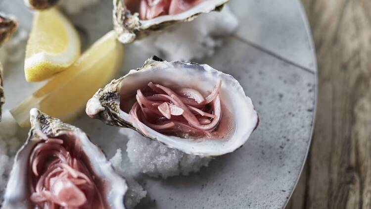 An elaborate entree in an oyster shell