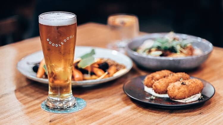 A beer, some croquettes and other bistro dishes