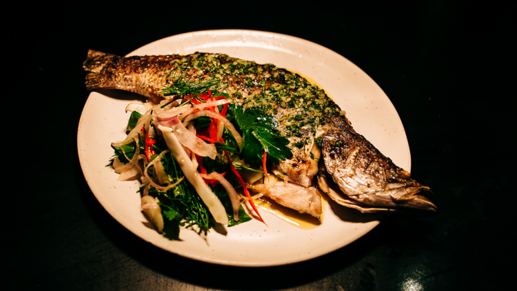 Whole fish with salad