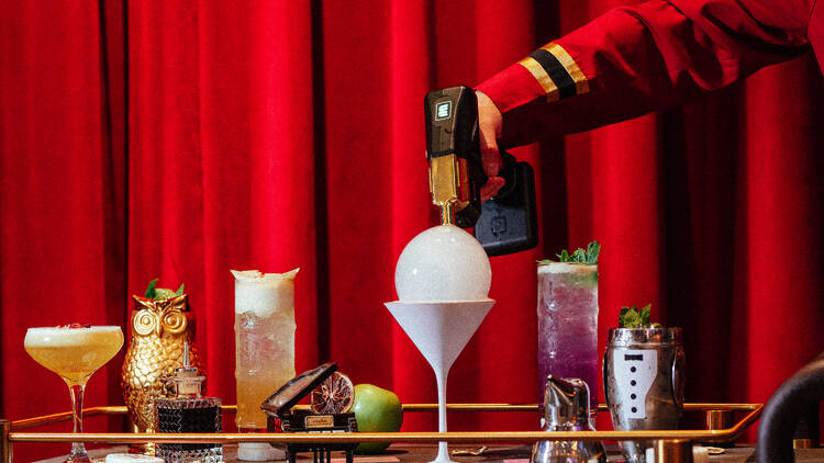 A range of funky cocktails on a bar table.