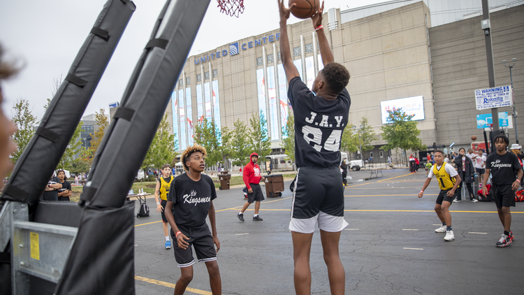 A group of kids play a game of basketball at Bulls Fest