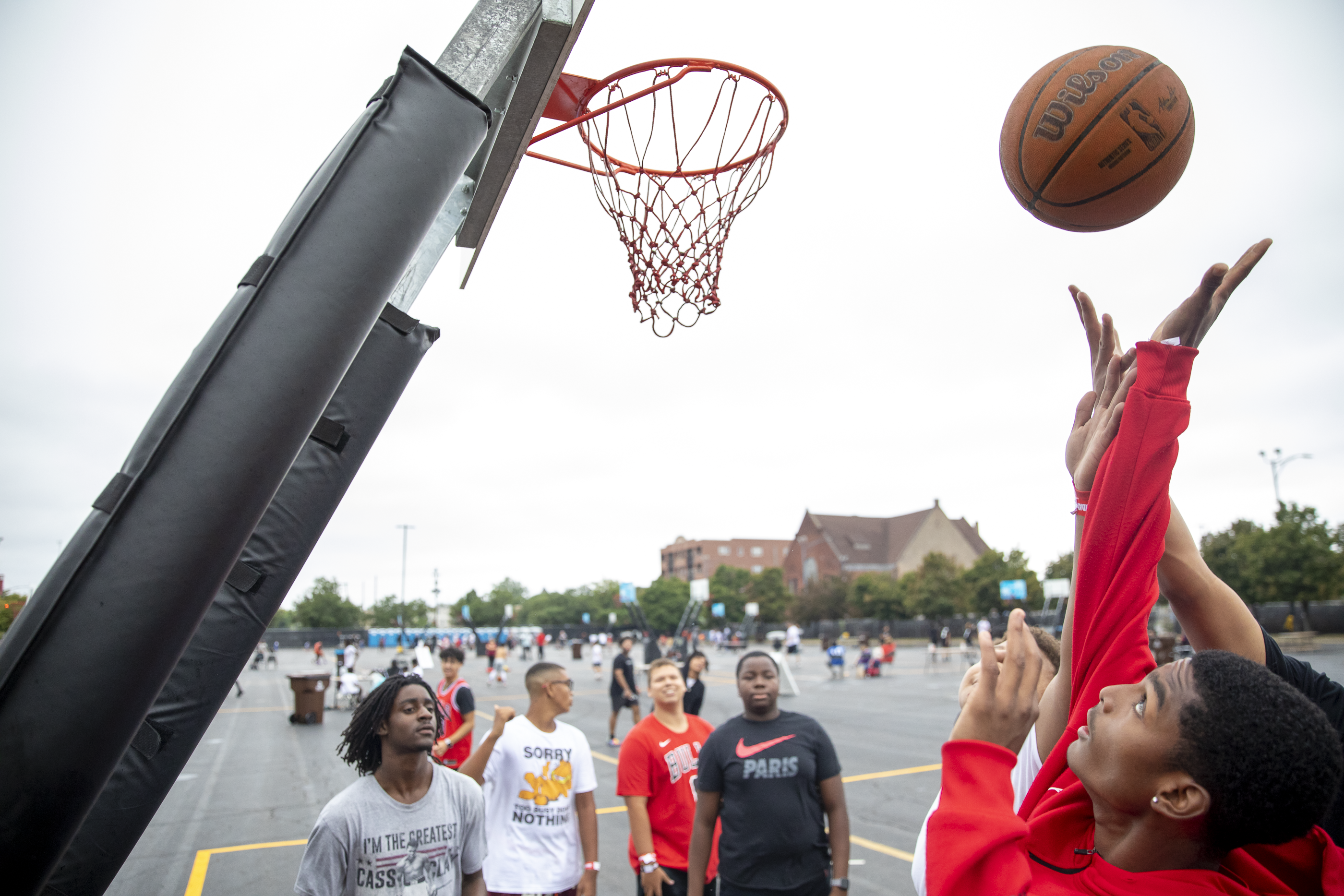 People try to shoot a basket during a game at Bulls Fest