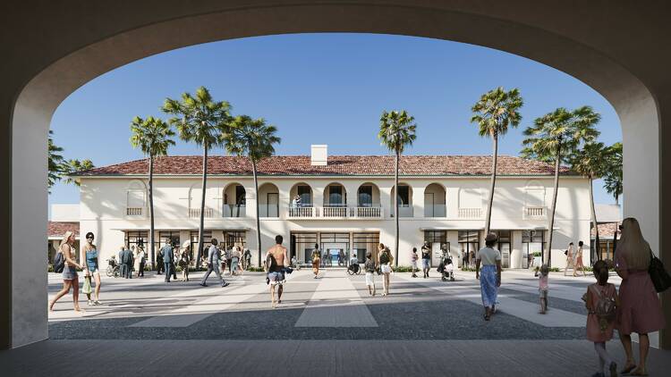 An image of Bondi Pavilion with people walking towards it