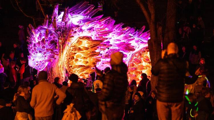 A pink and orange light installation