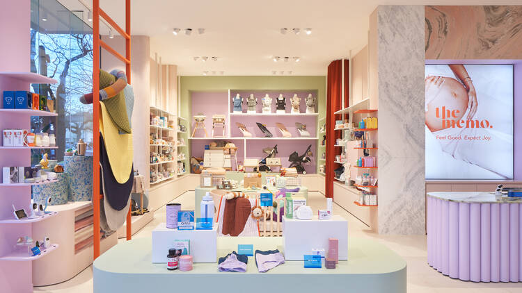 A baby store with shelves and countertops lined with baby accessories.