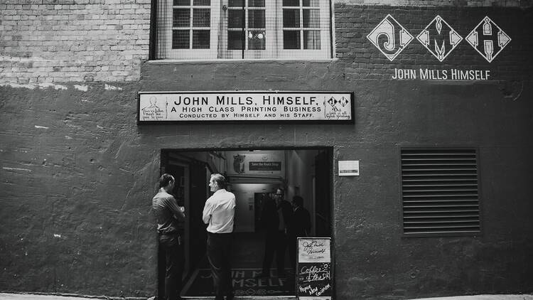 John Mills Himself storefront b&w