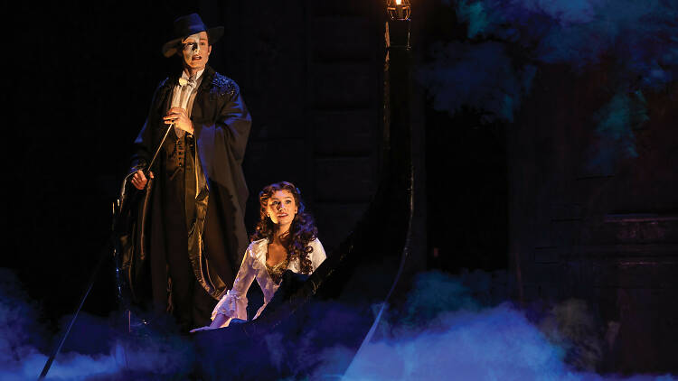 Phantom of the Opera on stage, a gondola is rowed through smoke