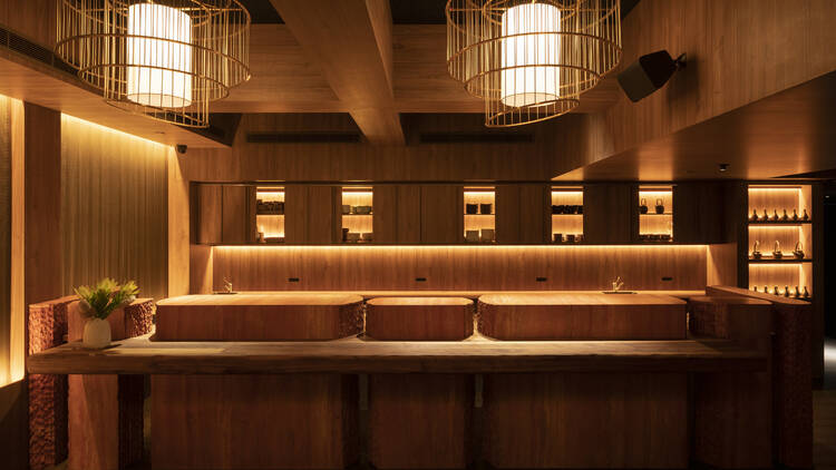 Wooden interiors and hanging light fittings inside Yugen Restaurant