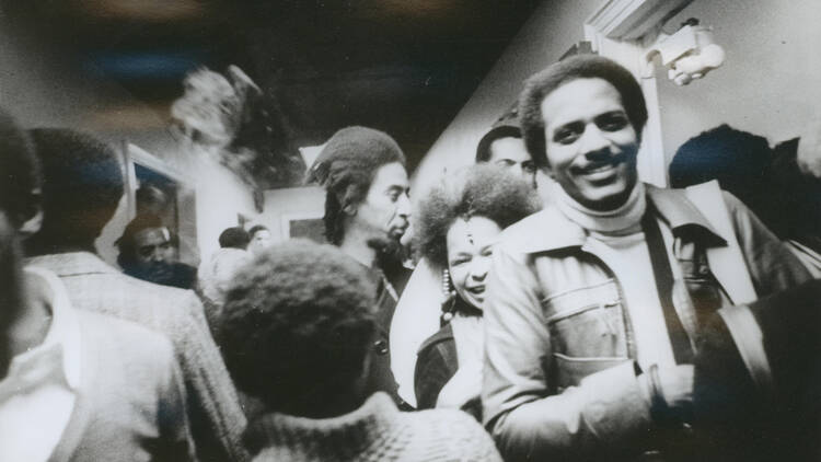 Barbara Mitchell (center right) and Tyrone Mitchell (far right) at the opening of the exhibition Synthesis, November 18, 1974.