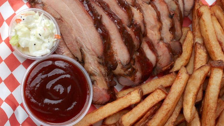 Turkey tips with fries, coleslaw and a side of barbecue sauce.