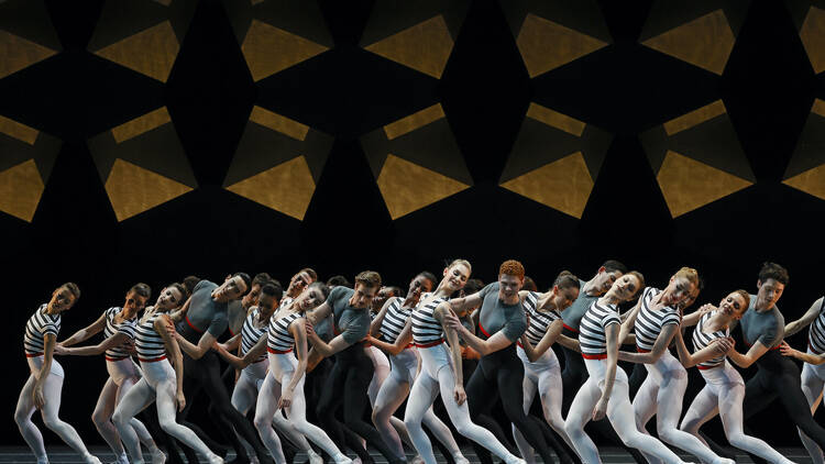 Dancers in striped outfits on stage