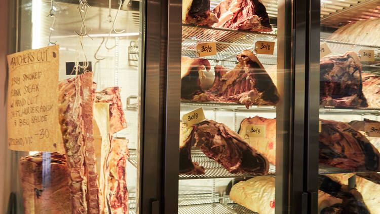 A fridge with ageing cuts of meats 