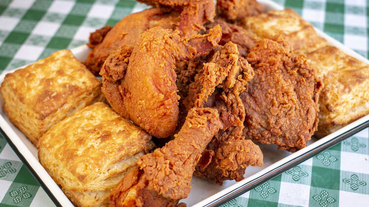 A platter of fried chicken and biscuits.