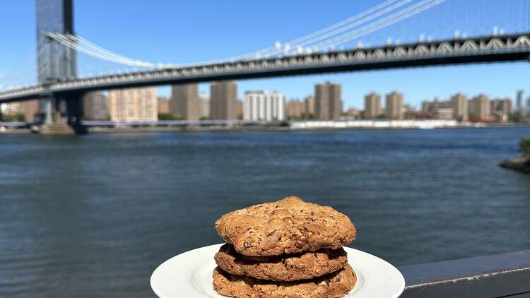 Cookies from Time Out Market's Dough doughnuts location with the East River, bridge and Manhattan skyline in the background. 