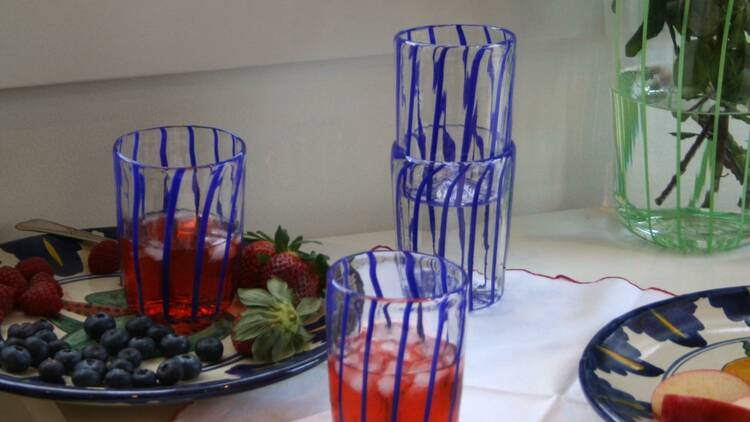 An array of blue and clear drink cups. 