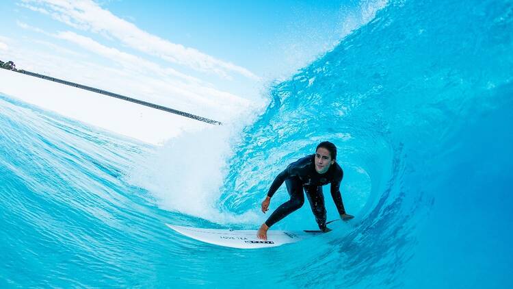 A surfer enjoying an artificial wave at Urbnsurf