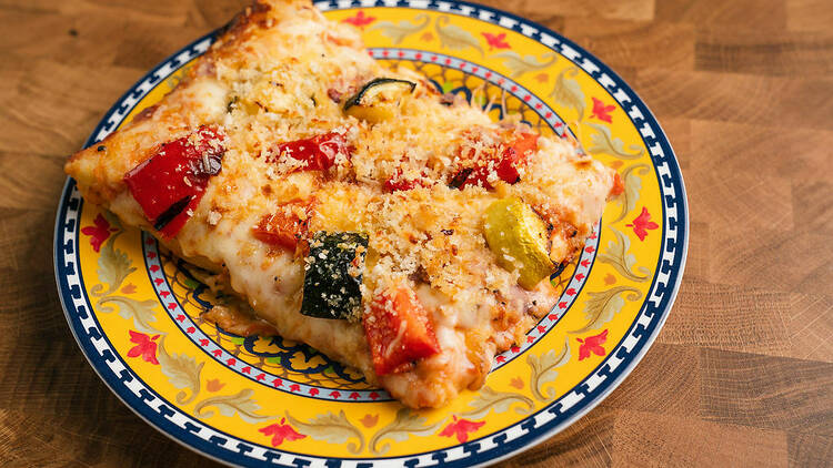 A slice of Sicilian-style pizza.