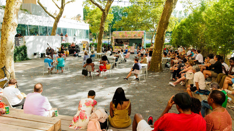 People gather outside for Jazz in the Garden in August 2022.