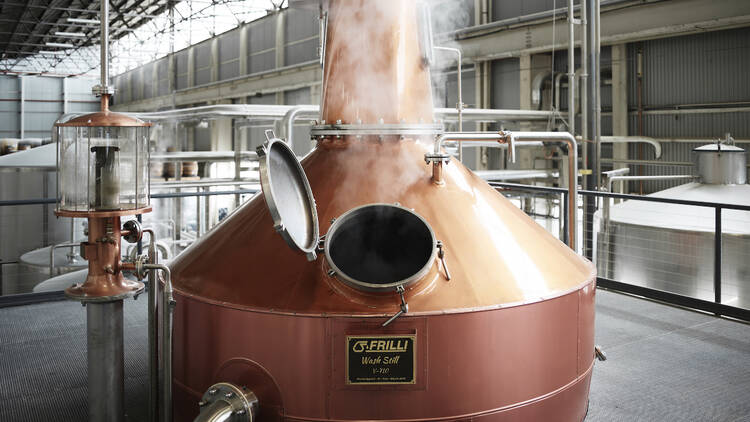 Inside the Starward distillery factory there is a large copper vat 