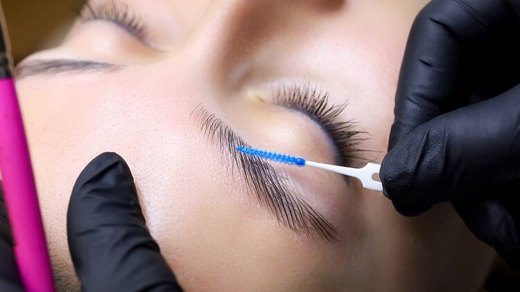 A client receiving a brow lamination treatment.